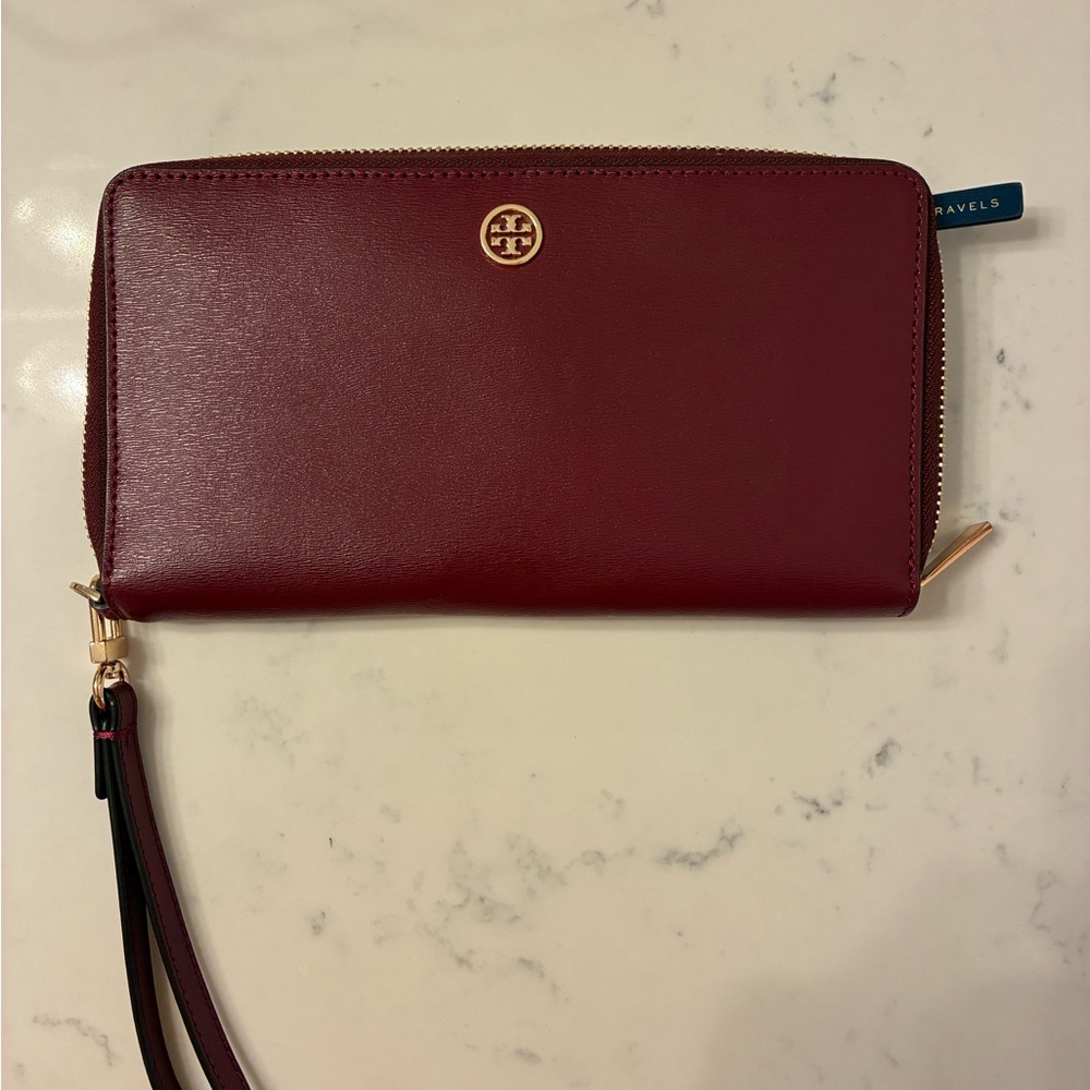 Tory Burch zip around travel wallet with wrist strap